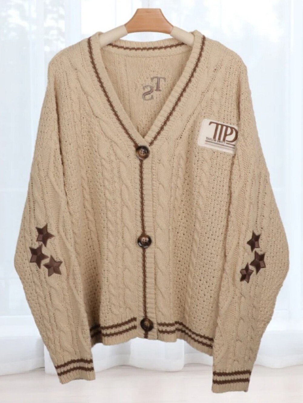 Taylor Swift Beige Cable Knit Cardigan with Brown Trim & Star Patches